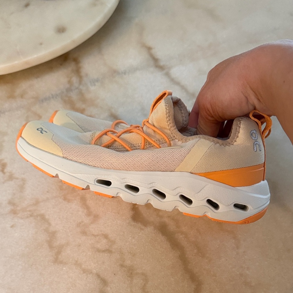 On Running Tan and Orange Athletic Shoes